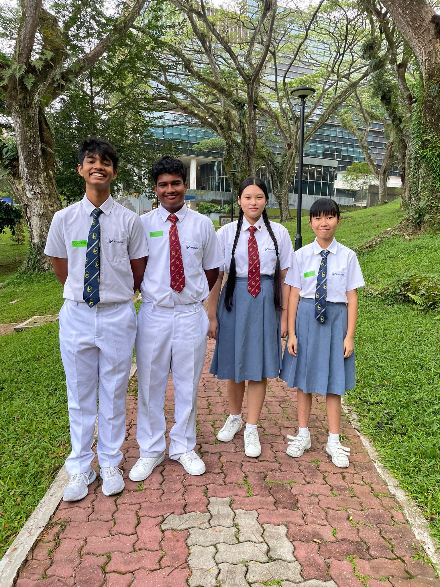 4 students standing at NUS